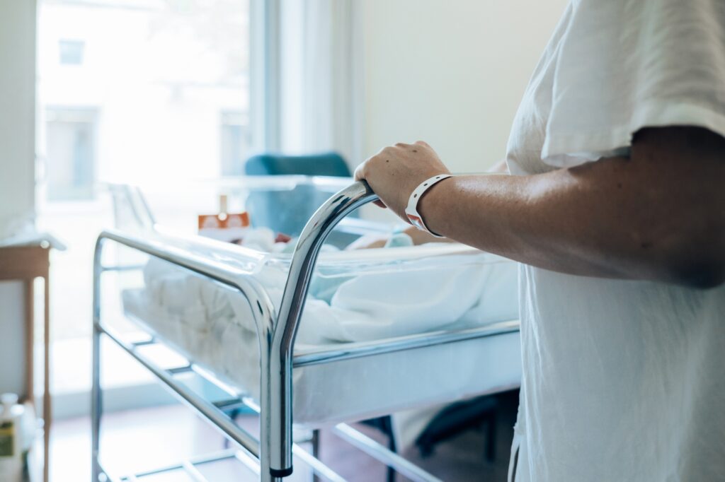 woman in hospital with her baby